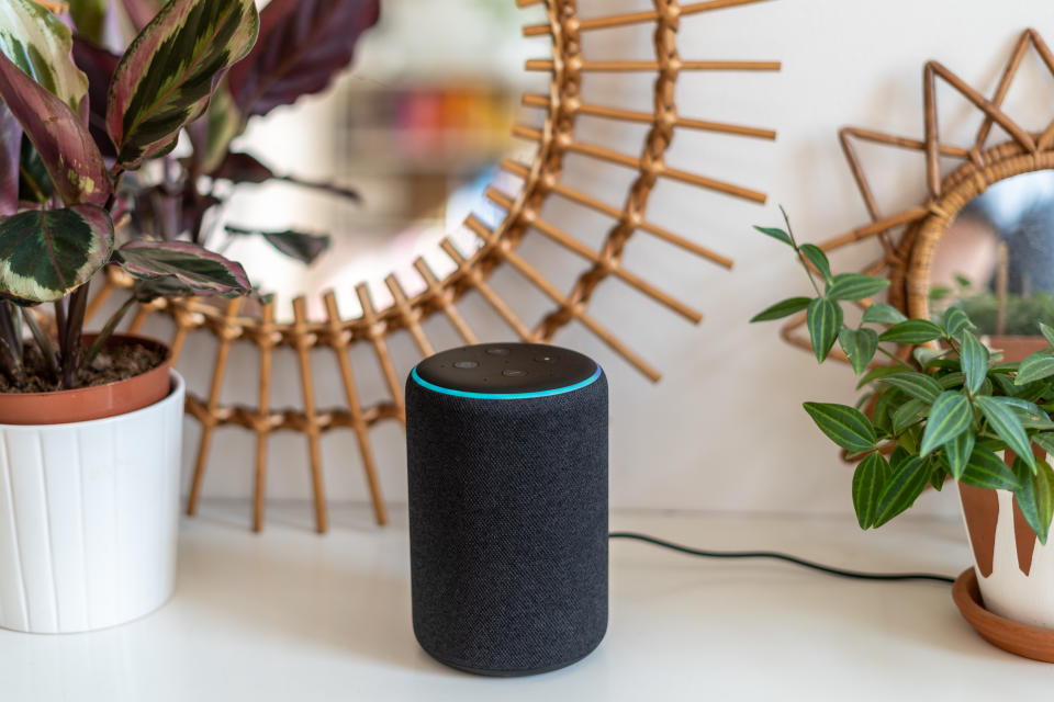 VIENNA,AUSTRIA - April 4 : Amazon Alexa Echo Plus on a white table with green plants in the background