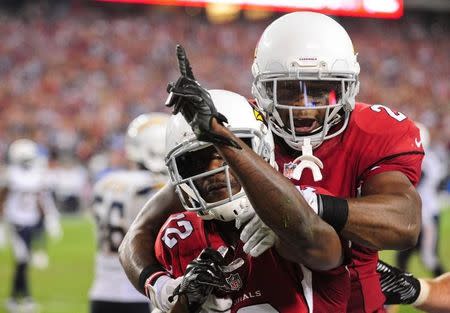 Sep 8, 2014; Glendale, AZ, USA; Arizona Cardinals wide receiver John Brown (12) celebrates with running back Jonathan Dwyer (20) after scoring a 13 yard touchdown during the second half against the San Diego Chargers at University of Phoenix Stadium. Mandatory Credit: Matt Kartozian-USA TODAY Sports