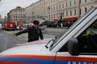 General view of emergency services attending the scene outside Sennaya Ploshchad metro station, following explosions in two train carriages in St. Petersburg, Russia, April 3, 2017. REUTERS/Anton Vaganov