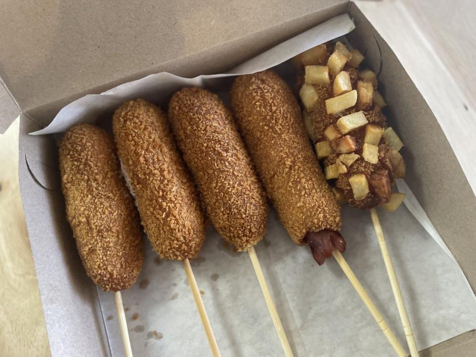 Korean corn dogs are a fun street food that covers hot dogs or cheese (or both!) in crispy panko bread crumbs and topped with fried potatoes or sugar.