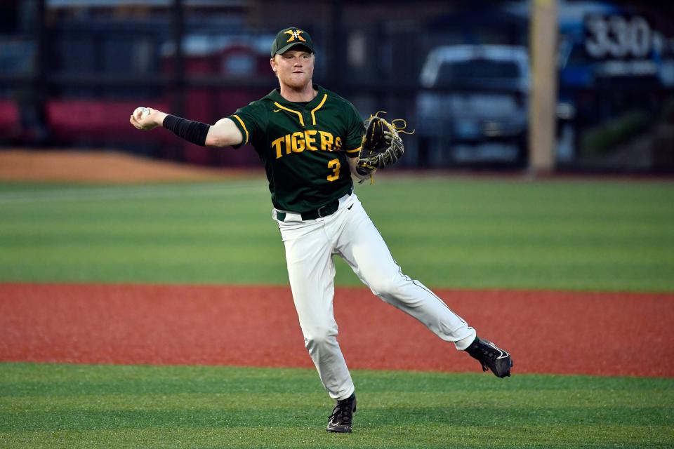 St. Xavier's Cooper Smith (3) makes a throw to first during action of their Seventh Region Championship baseball game against Trinity, Sunday, May 29 2022 in Louisville Ky. St. Xavier won 11-0 after he game was called at the end of the fifth inning, and will now play for the state championship.