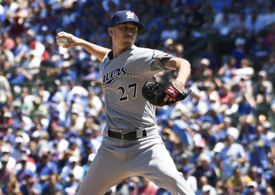 Milwaukee Brewers starting pitcher Zach Davies (27) throws the ball against the Chicago Cubs during the first inning of a baseball game, Friday, Aug. 2, 2019, in Chicago. (AP Photo/David Banks)