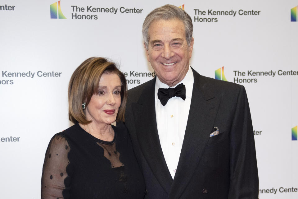 FILE - Speaker of the House Nancy Pelosi, D-Calif., and her husband, Paul Pelosi, arrive at the State Department for the Kennedy Center Honors State Department Dinner, on Dec. 7, 2019, in Washington. The man charged in last year's attack against former U.S. House Speaker Pelosi's husband is scheduled to appear in federal court Wednesday, July 19, 2023, to request the trial be moved out of San Francisco. (AP Photo/Kevin Wolf, File)