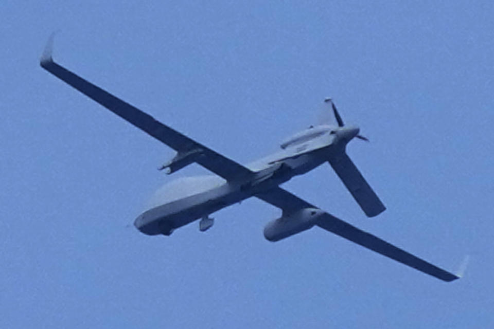 An unidentified drone flies over the areas of Second Thomas Shoal, locally known as Ayungin Shoal, at the disputed South China Sea while Chinese coast guard ships tries to block Philippine coast guard ships and supply boat during a rotation and resupply mission on Tuesday, Aug. 22, 2023. As a U.S. Navy plane circled overhead, two Philippine navy-manned boats manage to breach through a Chinese coast guard blockade in a dangerous confrontation in the disputed South China Sea and succeeded in delivering food and other supplies to Filipino forces guarding a contested shoal on board BRP Sierra Madre. (AP Photo/Aaron Favila)