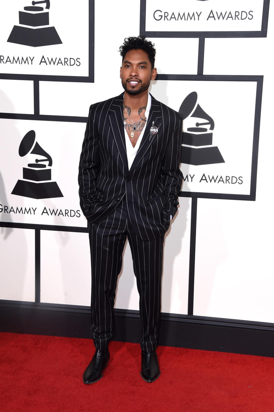Best: Miguel in a striped suit with a low-cut top at the 58th Grammy Awards at Staples Center in Los Angeles, California, on February 15, 2016.