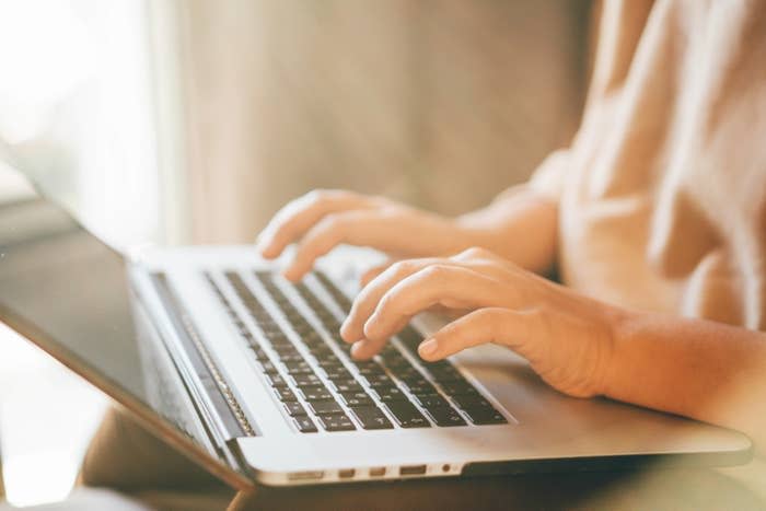 a person typing on a computer