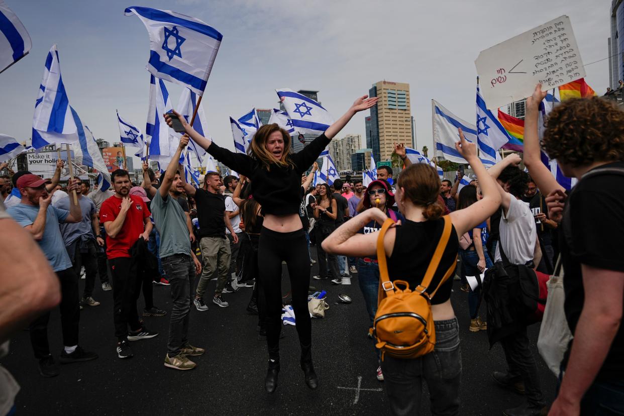 Demonstrators block a highway during protest against plans by Prime Minister Benjamin Netanyahu’s government (Copyright 2023 The Associated Press. All rights reserved.)
