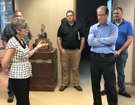 Mike Braun, a Republican candidate for Senate in Indiana, accompanied by Iowa Republican senator Joni Ernst, makes a campaign stop at Beck's Hybrids, a seed business in Atlanta, Indiana, U.S. September 19, 2018. REUTERS/Joe Tanfani