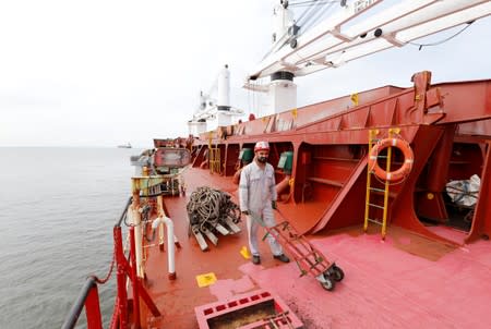 A member of the crew of the Iranian vessel Bavand is seen near the port of Paranagua