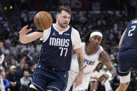 Dallas Mavericks guard Luka Doncic, left, dries toward the basket as Los Angeles Clippers guard Brandon Boston Jr. follows during the second half in Game 5 of an NBA basketball first-round playoff series Wednesday, May 1, 2024, in Los Angeles. (AP Photo/Mark J. Terrill)