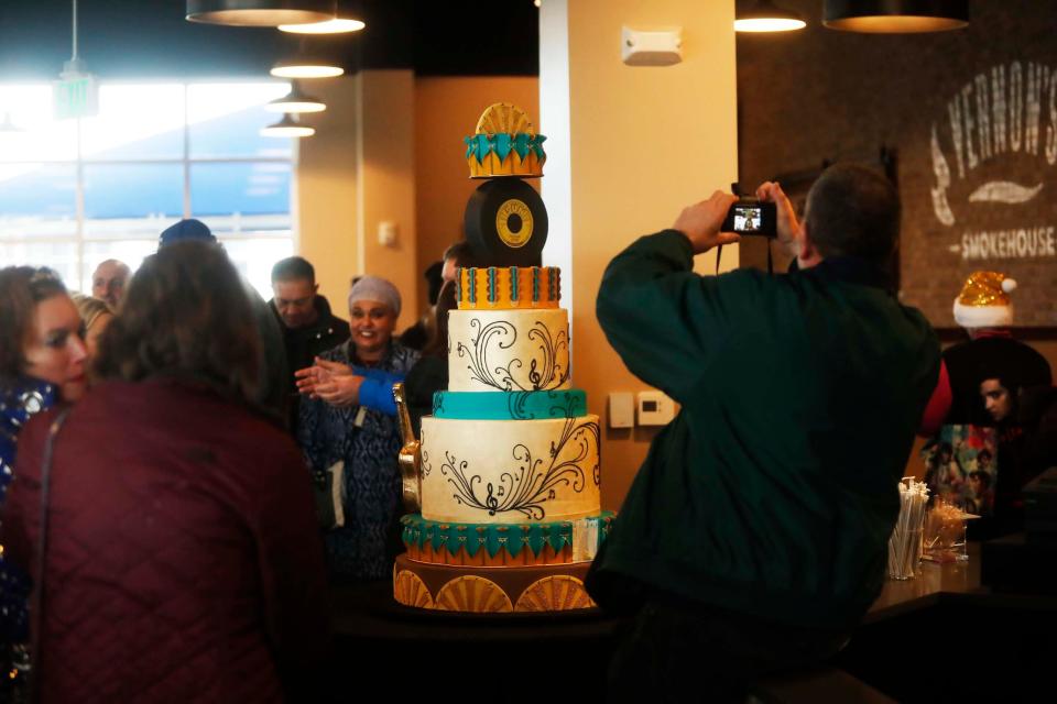An Elvis fan takes a photo of Elvis’ birthday cake at Vernon’s Smokehouse at Graceland in Memphis on Monday, Jan. 8, 2024, what would have been Elvis Presley's 89th birthday. Fans from around the world came out to celebrate the King's birthday.