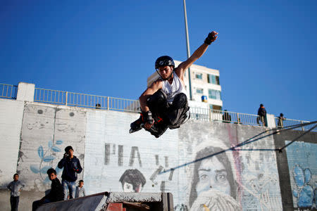 Palestinian Mohammad Al-Sawalhe, 23, a member of Gaza Skating Team, practices his rollerblading skills in Gaza City March 8, 2019. REUTERS/Mohammed Salem