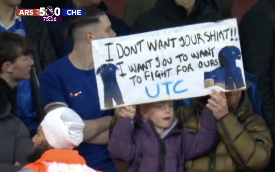 Chelsea fans hold up banner in disgust at their performance