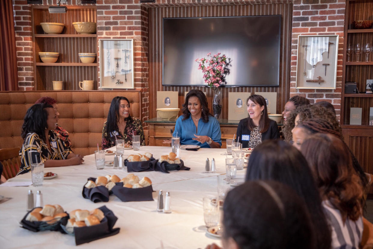 Michelle Obama surrounded by members of&nbsp;my HTX Book and Brunch club. (Photo: Courtesy of Isaac Palmisano)