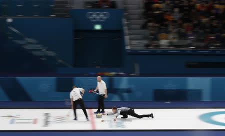 Curling - Pyeongchang 2018 Winter Olympics - Men’s Tie-Breaker - Switzerland v Britain - Gangneung Curling Center - Gangneung, South Korea - February 22, 2018 - Kyle Smith of Britain delivers a stone. REUTERS/Cathal McNaughton