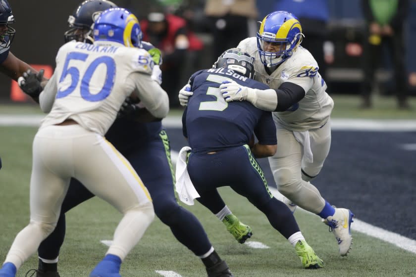 Seattle Seahawks quarterback Russell Wilson (3) is sacked by Los Angeles Rams defensive lineman Aaron Donald.