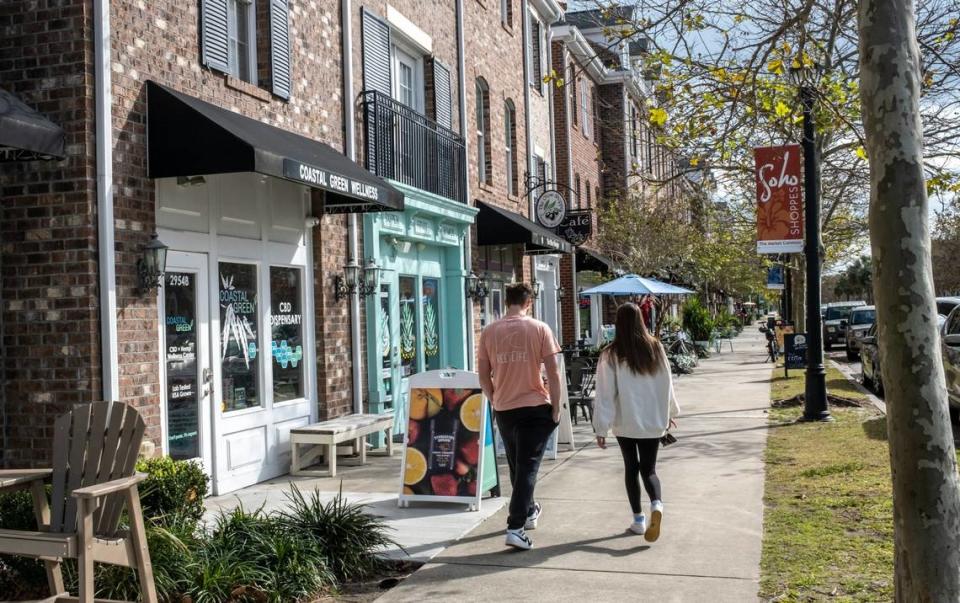 Shoppers stroll through The Market Common community in Myrtle Beach, S.C. November 14, 2022.