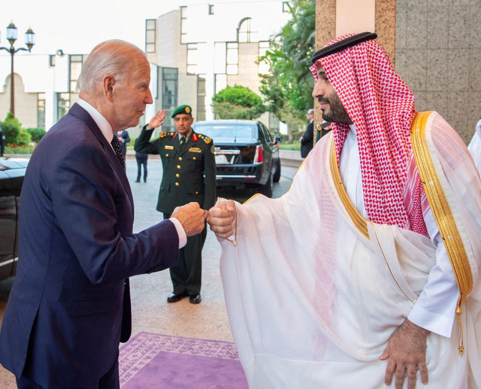 Saudi Crown Prince Mohammed bin Salman fist bumps President Biden upon his arrival at Al Salman Palace, in Jeddah, Saudi Arabia, July 15, 2022. Bandar Algaloud/Courtesy of Saudi Royal Court/Handout via REUTERS 