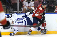 Tampa Bay Lightning left wing Ondrej Palat (18) goes against the boards as he chased the puck with Florida Panthers defenseman Brandon Montour (62) during the first period in Game 2 of an NHL hockey Stanley Cup first-round playoff series Tuesday, May 18, 2021, in Sunrise, Fla. (AP Photo/Lynne Sladky)