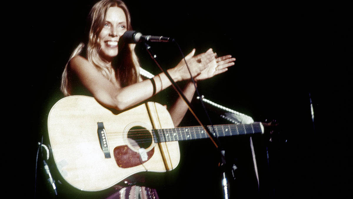  Joni Mitchell plays the Community Center in Berkley, CA. 1974. She is playin a Martin dreadnought. 