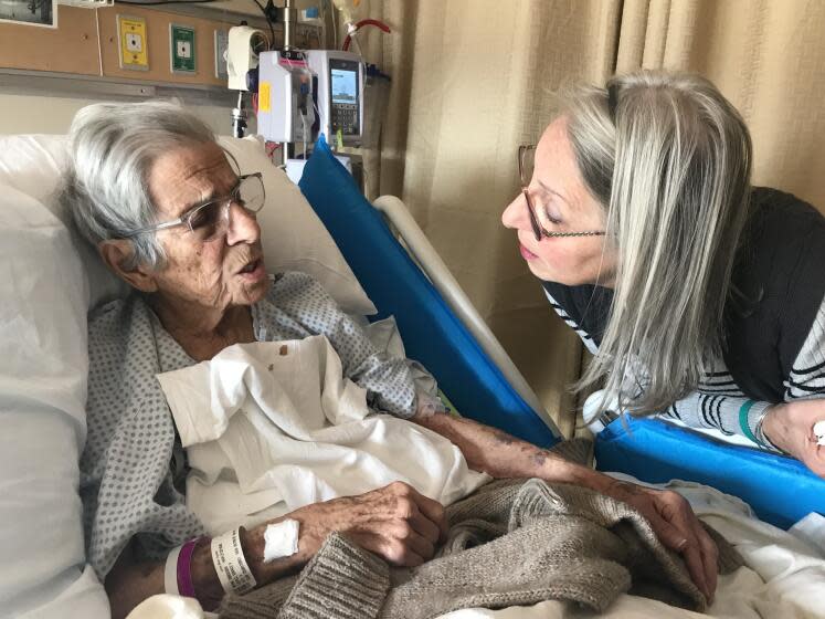 Steve Lopez's mother Grace Lopez, shortly before her death talking to my sister Debbie, her longtime caregiver (Family photo)