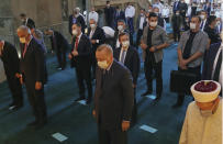 Turkey's President Recep Tayyip Erdogan, front center, takes part in Friday prayers in Hagia Sophia, at the historic Sultanahmet district of Istanbul, Friday, Aug. 7, 2020. Erdogan joined worshipers on July 24 for the first Muslim prayers in 86 years inside the Istanbul landmark that served as one of Christendom's most significant cathedrals, a mosque and a museum before its conversion back into a Muslim place of worship.(Turkish Presidency via AP, Pool)