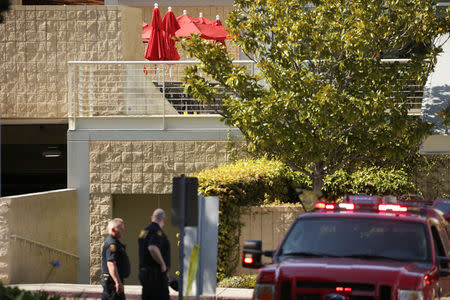 Law enforcement officers are seen near a patio with crime scene markers at Youtube headquarters following an active shooter situation in San Bruno, California, U.S., April 3, 2018. REUTERS/Elijah Nouvelage