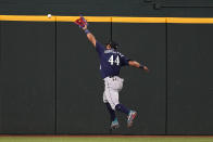 Seattle Mariners center fielder Julio Rodriguez is unable to catch up to a Texas Rangers' Adolis Garcia run-scoring double in the third inning of a baseball game, Sunday, June 4, 2023, in Arlington, Texas. (AP Photo/Tony Gutierrez)