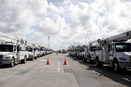 Trucks of the Florida Power & Light Company are seen ahead of the arrival of Hurricane Dorian in Daytona Beach
