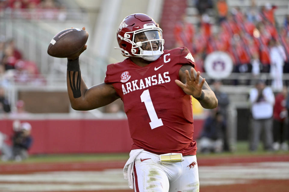 Arkansas quarterback KJ Jefferson (1) rolls out to pass against Auburn during an NCAA college football game Saturday, Nov. 11, 2023, in Fayetteville, Ark. (AP Photo/Michael Woods)