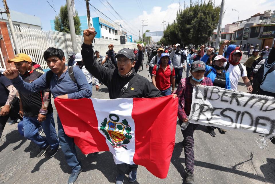 Supporters of ousted Peruvian President Pedro Castillo protest his detention in Arequipa, Peru, on Dec. 14. Castillo was detained on Dec. 7 after he was ousted by lawmakers when he sought to dissolve Congress ahead of an impeachment vote.