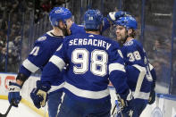 Tampa Bay Lightning left wing Brandon Hagel (38) celebrates his goal against the Florida Panthers with defenseman Erik Cernak (81) and defenseman Mikhail Sergachev (98) during the second period in Game 4 of an NHL hockey Stanley Cup first-round playoff series, Saturday, April 27, 2024, in Tampa, Fla. (AP Photo/Chris O'Meara)