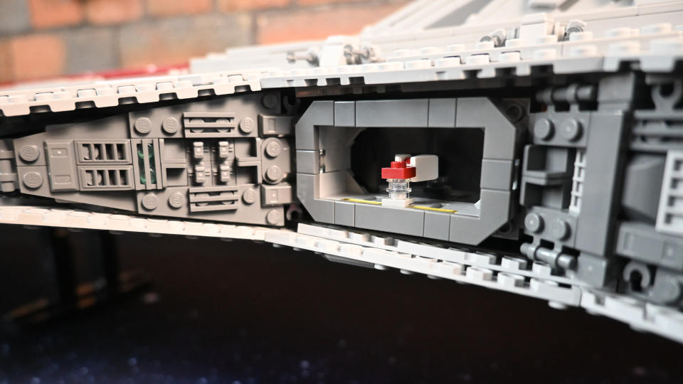 Lego UCS Venator kit close up of a hanger, with a tiny model inside