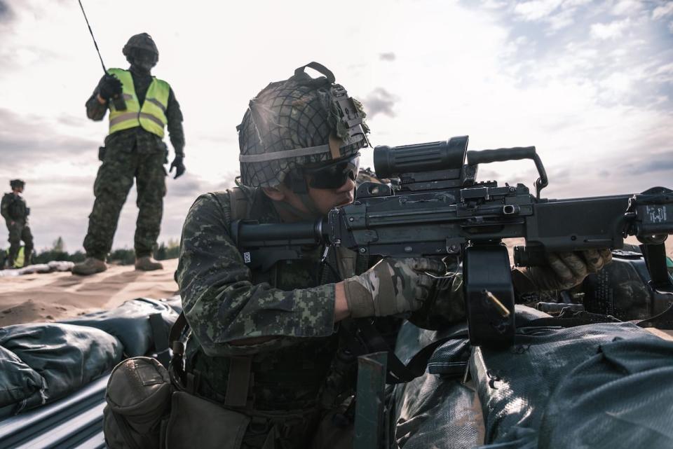 A Canadian soldier fires his machine gun during Exercise Steele Crescendo, which took place outside Riga, Latvia in 2020.