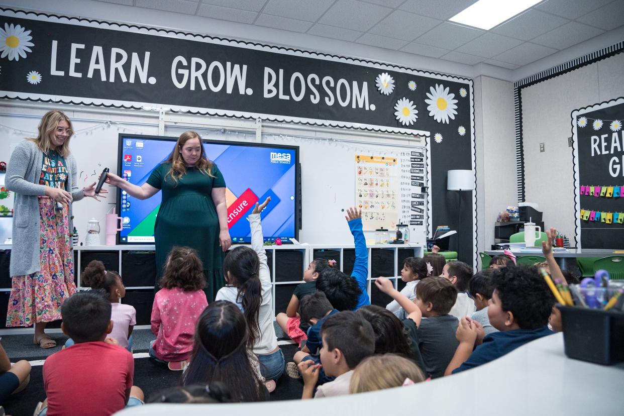 Student teacher Mary Pierce, left, and lead teacher Taylor Murphy teach together at the front of their kindergarten classroom at Stevenson Elementary on April 15, 2024, in Mesa, Arizona.