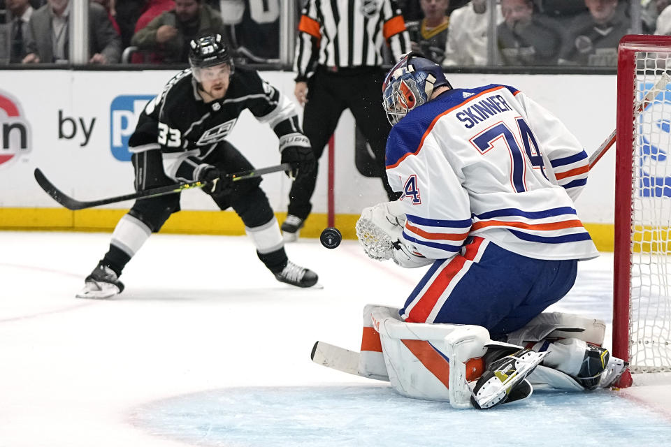 Los Angeles Kings right wing Viktor Arvidsson, left, tries to score on Edmonton Oilers goaltender Stuart Skinner during the second period in Game 3 of an NHL hockey Stanley Cup first-round playoff series Friday, April 21, 2023, in Los Angeles. (AP Photo/Mark J. Terrill)
