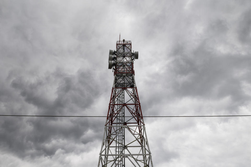 A view of an electronic surveillance tower near the village of Lagyna, at the Greek-Turkish border, Greece, Friday, May 21, 2021. An automated hi-tech surveillance network being built on the Greek-Turkish border aiming at detecting migrants early and deterring them from crossing, with river and land patrols using searchlights and long-range acoustic devices. (AP Photo/Giannis Papanikos)