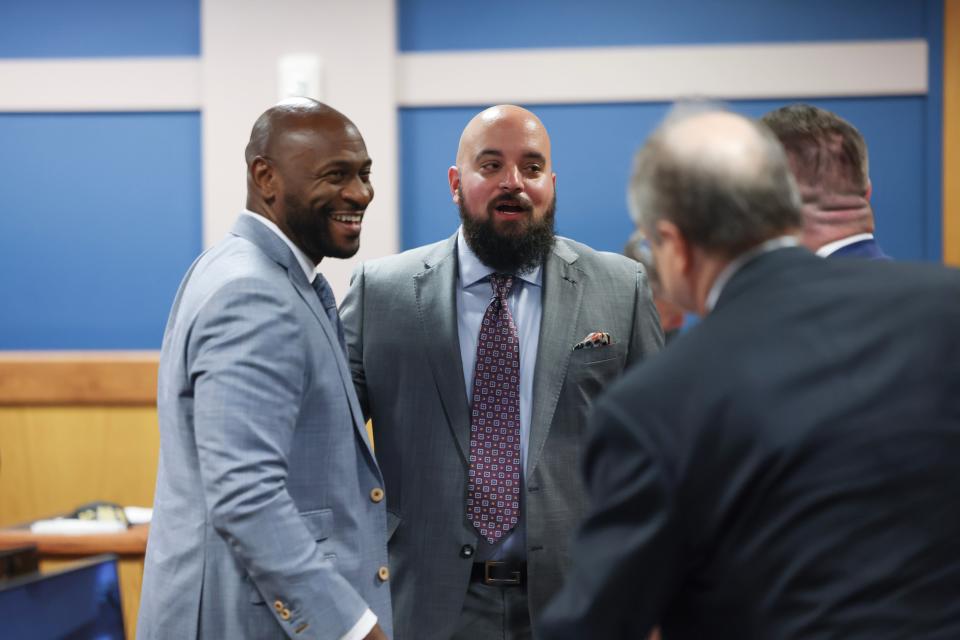 Special Prosecutor Nathan Wade (left), representing the District Attorney's office, talks with Attorney Scott Grubman, who is defending Ken Chesebro, and other attorneys after Fulton County Superior Judge Scott McAfee heard motions from attorneys representing Ken Chesebro and Sidney Powell in Atlanta on Wednesday, Sept. 6, 2023.