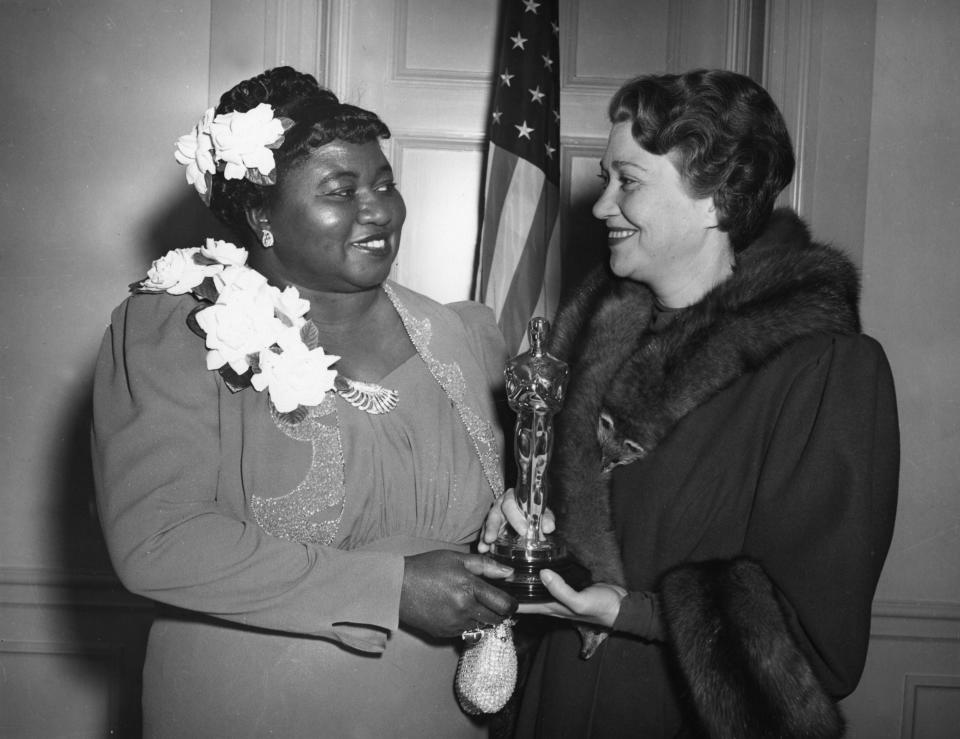 Hattie McDaniel, left, with presenter Fay Bainter at the 12th Academy Awards ceremony on Feb. 29, 1940. McDaniel made history that night as the first Black performer to win an Oscar.