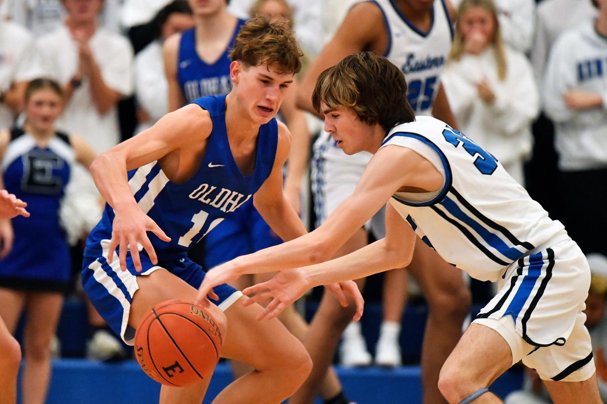 Oldham County's Max Green (10) and Eastern's Ashton Foreman battle for a loose ball during the second half, Green scored a game-high 29 points in the Colonels' 70-62 victory Friday night in the championship game of the 2023 Middletown Holiday Classic.