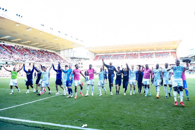Nottingham Forest players and staff celebrate securing survival after beating Burnley