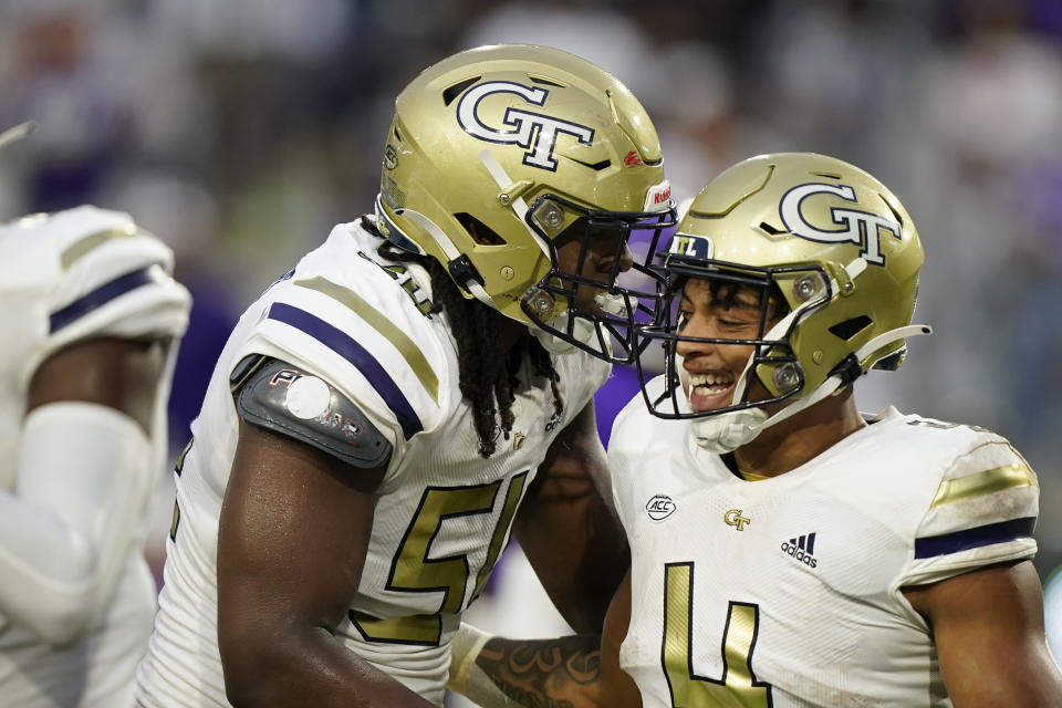 Georgia Tech running back Dontae Smith, right, celebrates with offensive lineman Jordan Williams, left, after scoring a touchdown in the first half of an NCAA college football game against Western Carolina, Saturday, Sept. 10, 2022, in Atlanta. (AP Photo/Brynn Anderson)