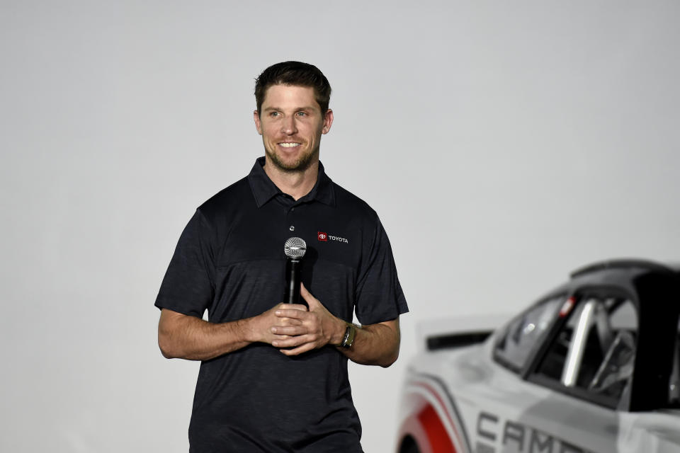 Driver Denny Hamlin talks about Toyota Camry Next Gen Cup car that will be used in the 2022 season during the NASCAR media event in Charlotte, N.C., Wednesday, May 5, 2021. (AP Photo/Mike McCarn)