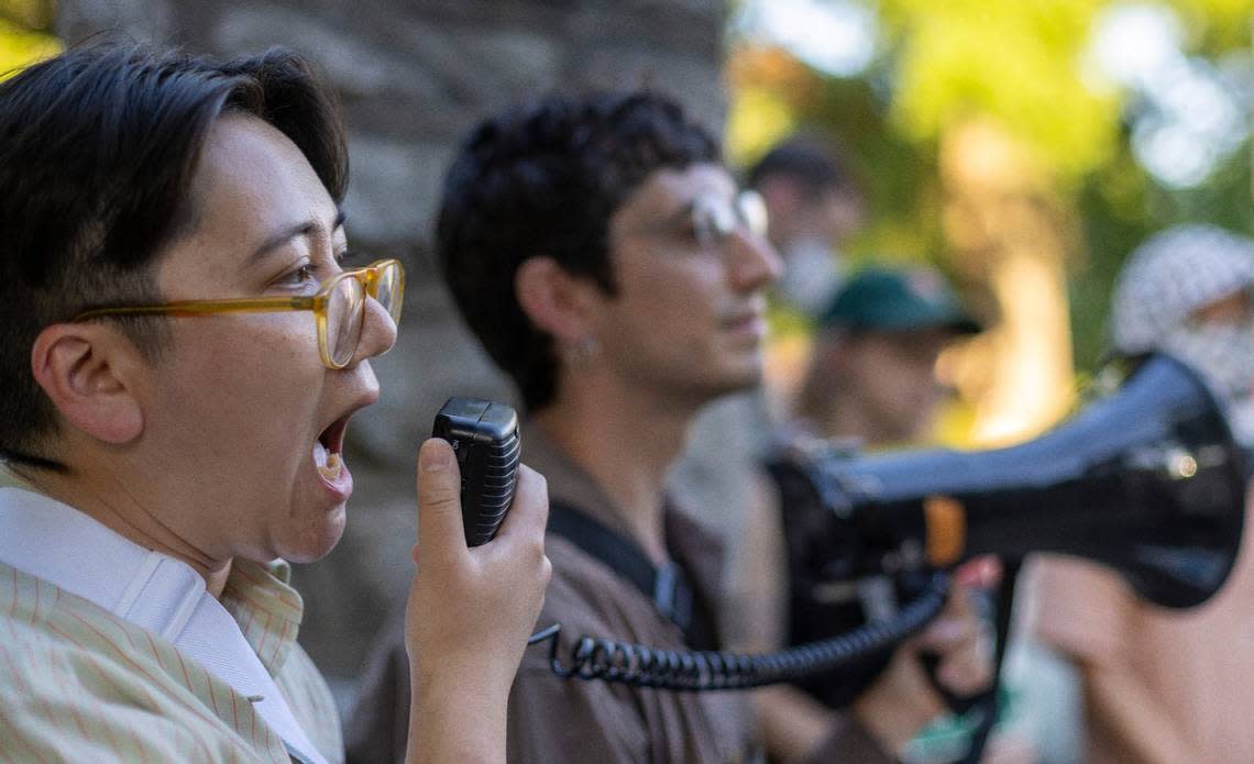 Emily Lim Rogers, a professor at Duke University, leads a demonstration at the entrance to the Duke campus, chanting ‘Free Palestine’, on Wednesday, May 1, 2024 in Durham, N.C.
