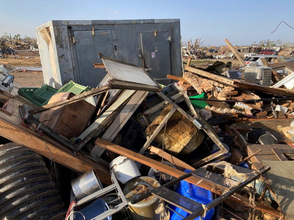 Debris covers the ground from a diner, Chuck’s dairy bar early Saturday, March 25, 2023, in Rolling Fork, Mississippi.  The two owners and six employees survived the tornado Friday night by hiding out in the cooler when the building was hit the building is completely destroyed and is adjacent to the mobile home park.