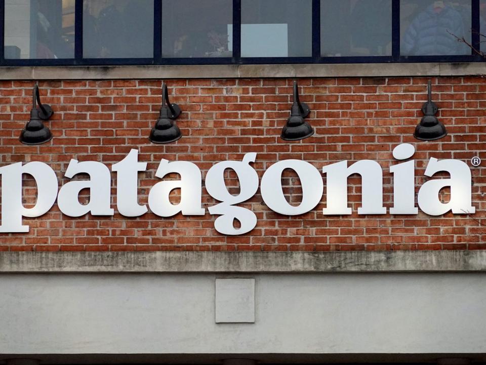 A sign hangs in front of a Patagonia store on October 29, 2021 in Chicago, Illinois. Patagonia announced it is stopping all paid advertising on Facebook Inc. platforms following a series of negative stories about the social networking company prioritizing profits over social responsibilities.