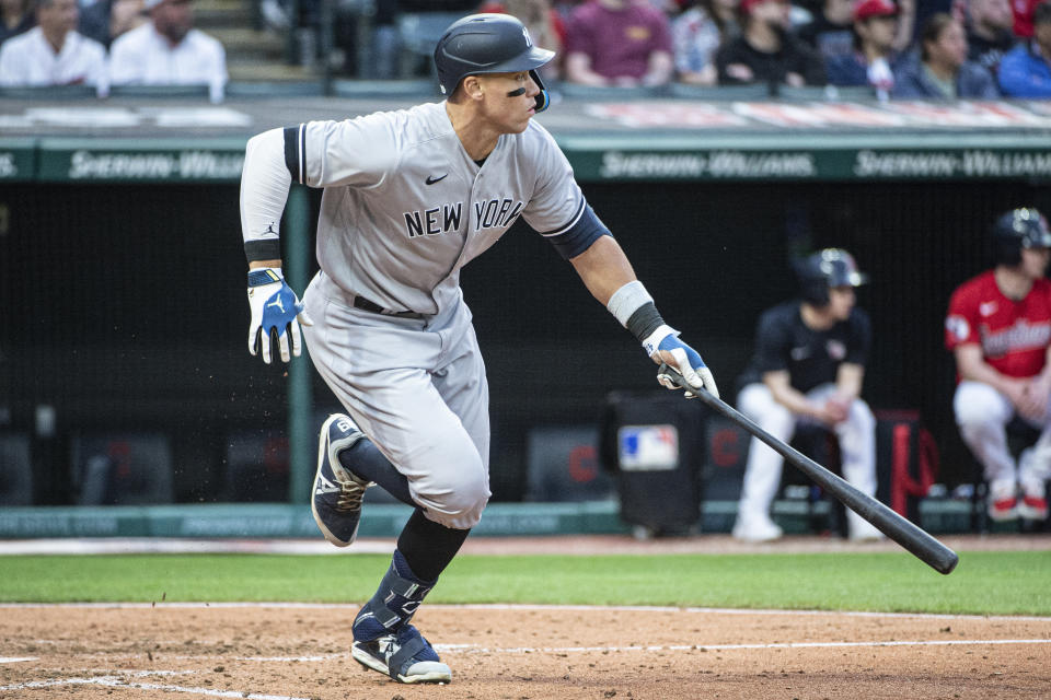 New York Yankees' Aaron Judge watches his single off Cleveland Guardians relief pitcher Xzavion Curry during the sixth inning of a baseball game in Cleveland, Tuesday April 11, 2023. (AP Photo/Phil Long)