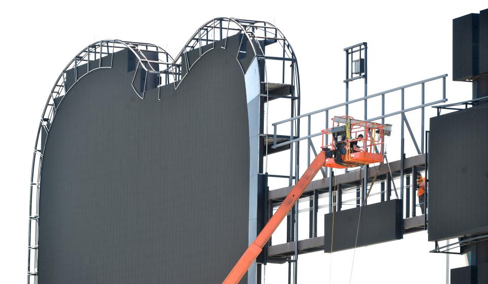 Technicians replace LED panels on the iconic guitar scoreboard at First Horizon Park on May 7, 2020. The tornado that tore through Nashville on March 3 caused an estimated $1.5 million to $2 million in damage to the stadium, with the guitar-shaped scoreboard in right field getting the worst of it. Nearly all of the damage to the scoreboard was done to the neck of the guitar.