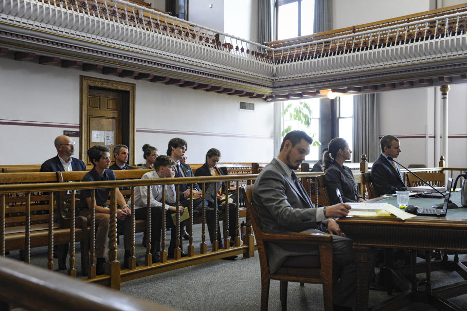 FILE - Youth plaintiffs look on during a status hearing for Held vs. Montana in the Lewis and Clark County Courthouse in Helena, Mont., Friday, May 12, 2023. District Court Judge Kathy Seeley dismissed part of a lawsuit filed by young people challenging the state's energy policy after the Legislature repealed it. However, she said a trial is still needed to decide if rules by which the state evaluates fossil fuel development are constitutional because they don't allow consideration of the effect of greenhouse gases. The scheduled two-week trial is set to start on June 12, 2023. (Thom Bridge/Independent Record via A, FileP)
