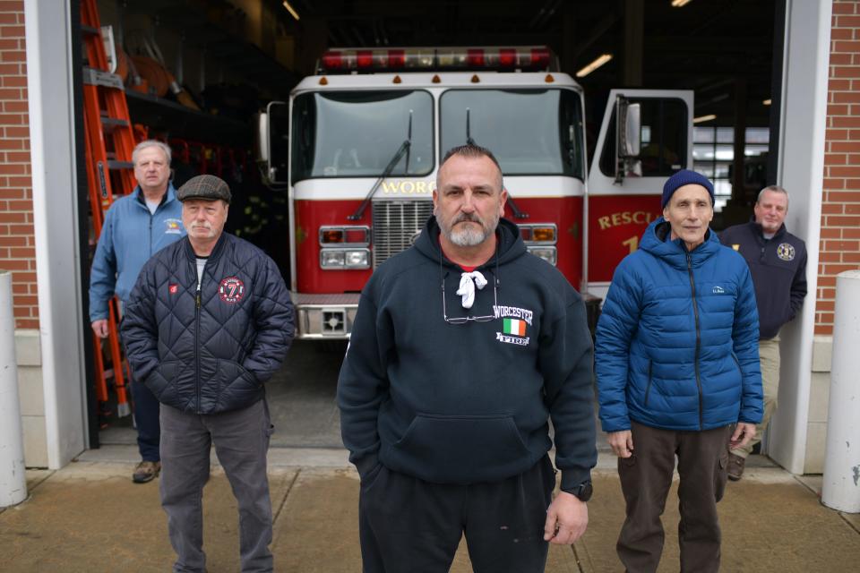 Retired firefighter Paul Cotter, center, and David Ford, left, Mark Whalen, Bill Bernhard and Rob Pastor outside of the Franklin Street Fire Station last February in Worcester.